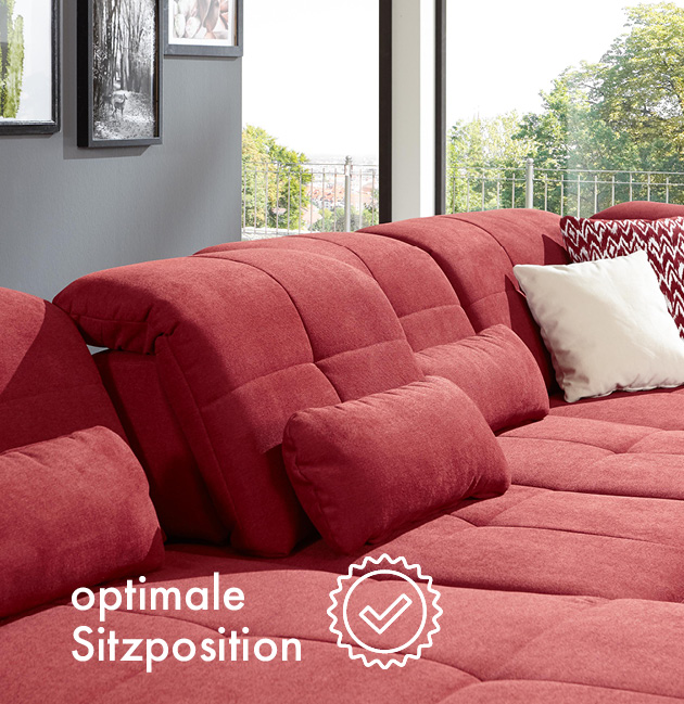 Rotes Sofa mit Sitztiefenverstellung